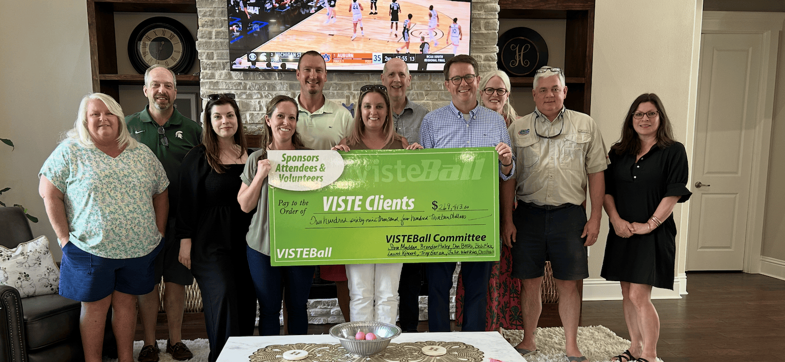 VISTEBall check presentation event! Pictured left to right: Debbie Hamilton, Terry Hamilton, Kassia Allam, Liz Haley, Brandon Haley, Kayla McClenthen, Steve Bissonnette, Steve Madden, Stephanie Madden, Chris Asbill, and Gina Brown.